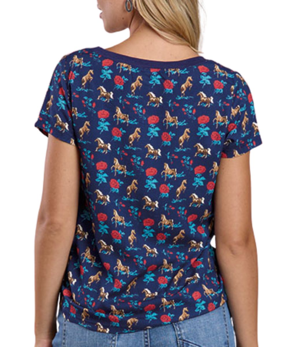 Back view of women's blue Roper tee featuring roses and horses contrast print on sleeves and back panel.
