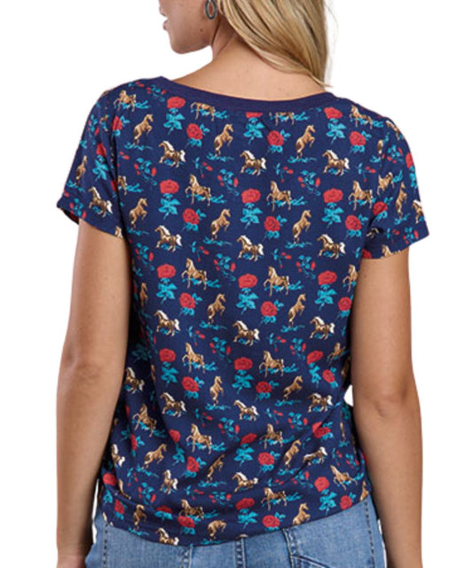 Back view of women's blue Roper tee featuring roses and horses contrast print on sleeves and back panel.