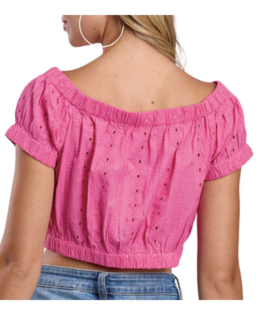 Back view of the women's magenta pink eyelet crop top can be worn off the shoulders