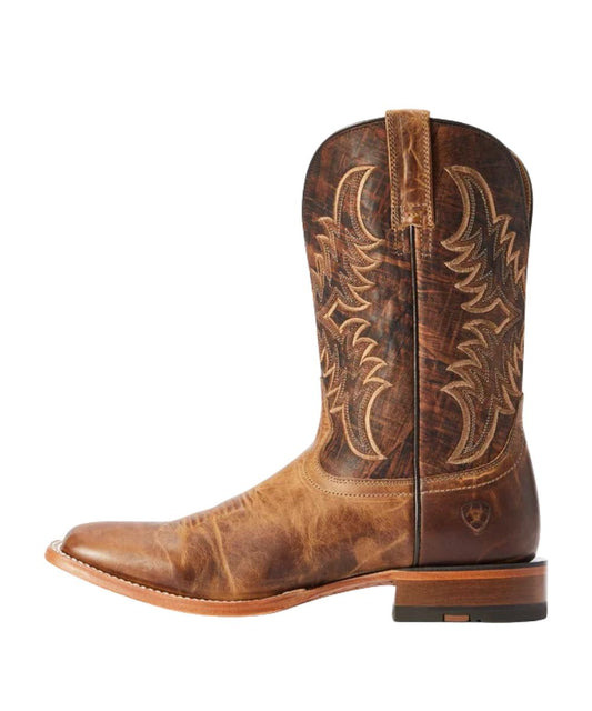 Left side view of the men's distressed artisan leather boot featuring the dry creek tan vamp, brown piping, bold stitching, four-row stitch pattern with embroidery, and the burnt brown shaft