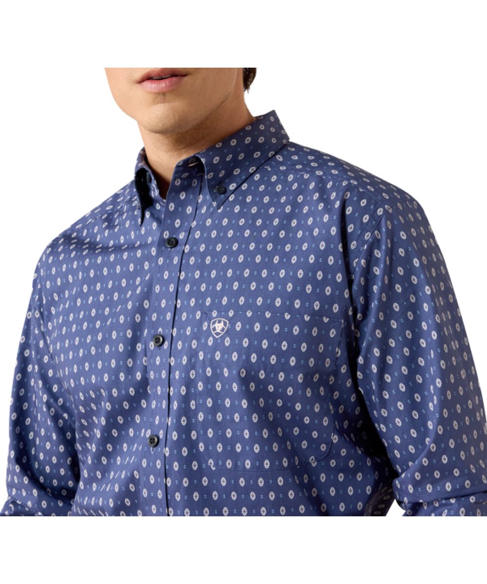 Close-up view of the southwestern geometric print and open chest pocket with a hidden pen slot