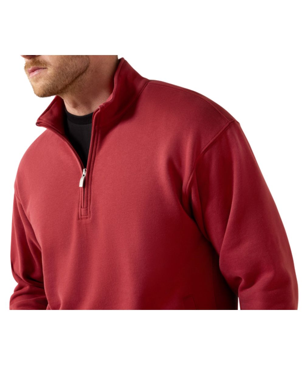 Close-up view of the men's long sleeve 1/4 zip pullover featuring the brick red solid print