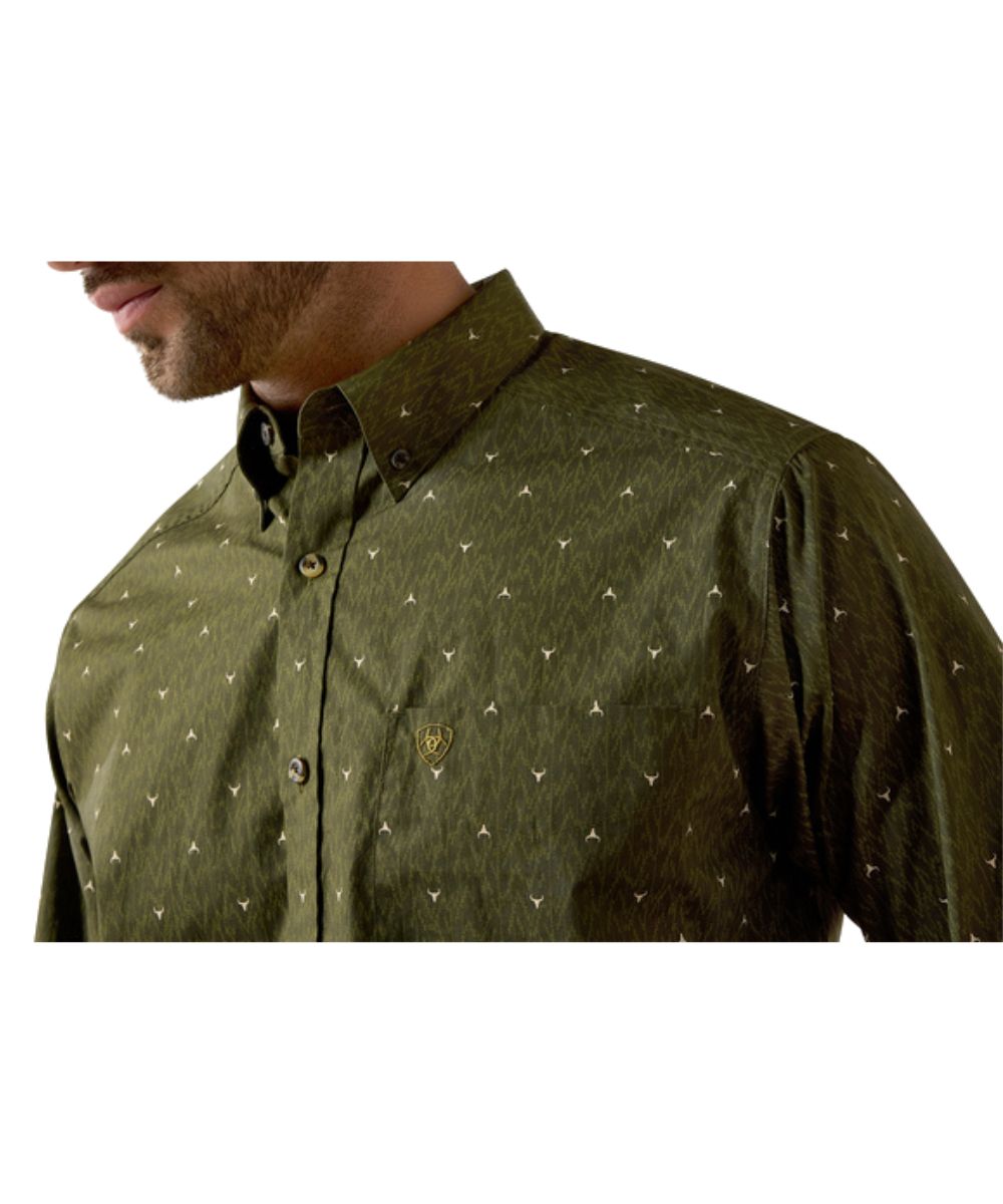 Close-up view of the ikat longhorn print and single open chest pocket with a hidden pen slot