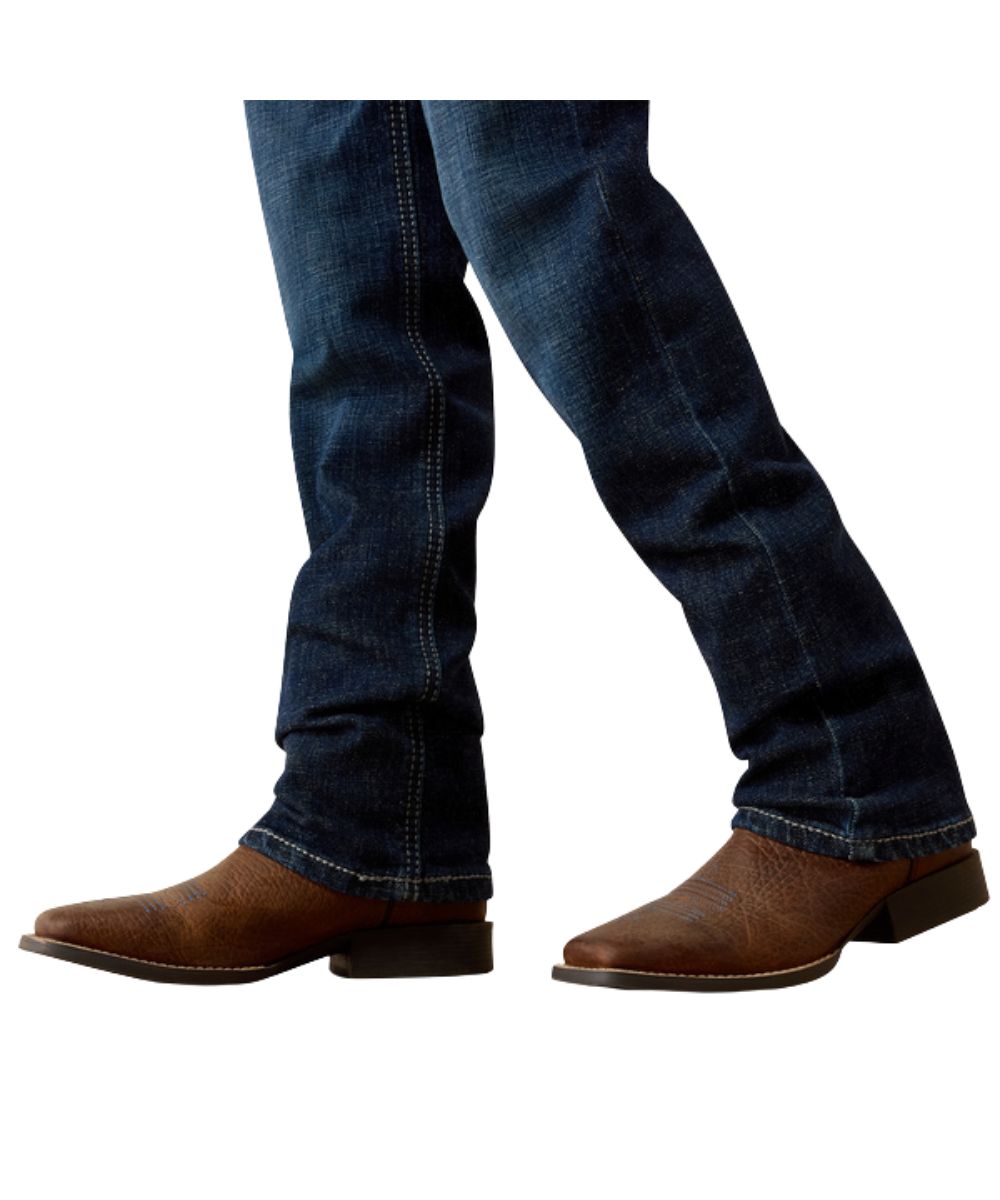 Close-up view of the boy's straight leg featuring the 15.25" stackable leg opening