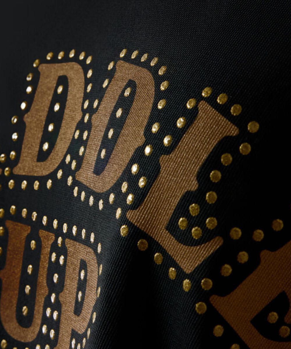 Close-up view of the gold toned front graphic