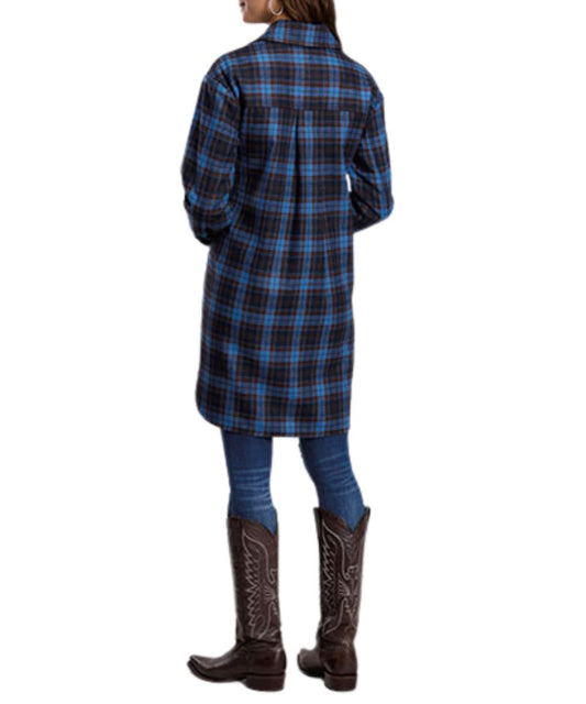 Back view of the women's long sleeve oversized shirt jacket featuring the blue plaid print, straight back yoke with an inverted box pleat, and long length