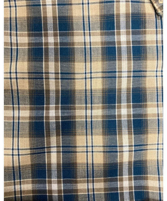 Close-Up View Of The Tan And Blue Plaid Print