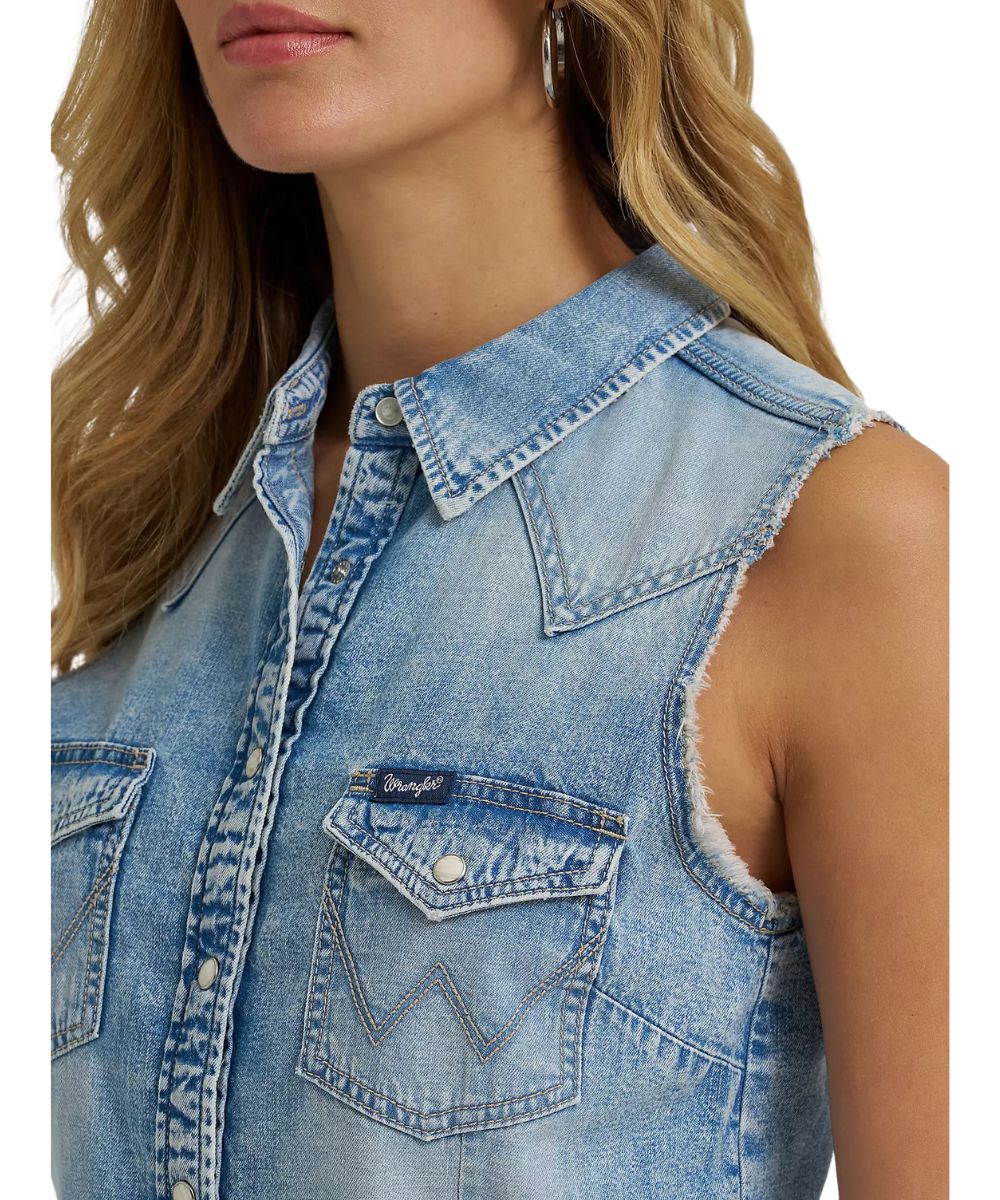 Close-Up View Of The Women's Light Wash Sleeveless Denim Snap Shirt With Pearl Snaps