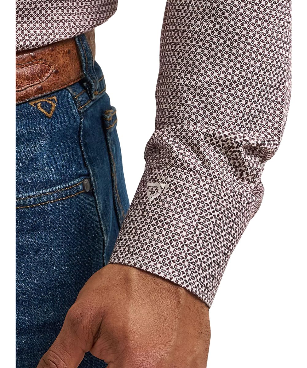 Close-up view of the mitered cuff with cody johnson's signature logo embroidery on the wine clover printed men's shirt in burgundy