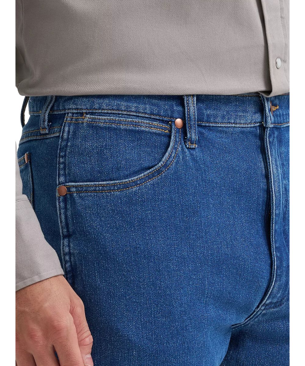 Close-up view of the coin pocket featuring the five pocket styling and high rise
