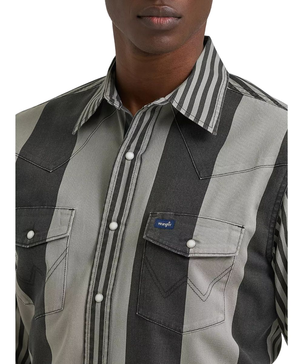 Close-up view of the brushpopper striped print featuring the pearl snaps, snap flap chest pockets, western yokes, and pen slot