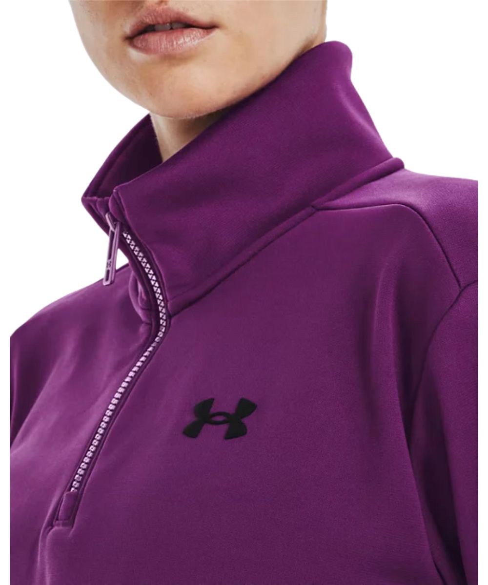 Close-up view of the purple polyester pullover featuring the black logo label at the left chest