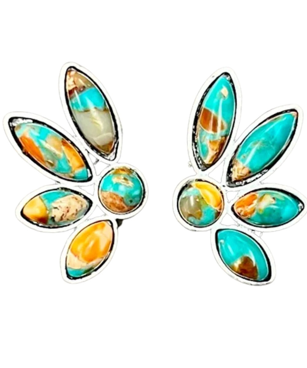 A pair of silver-toned earrings featuring turquoise, orange, and brown marbled gemstones, set against a plain white background.