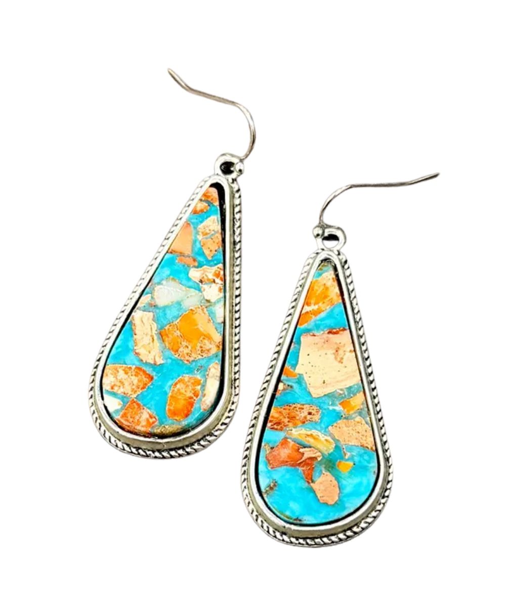 Flat lay view of the women's dangle gemstone earrings