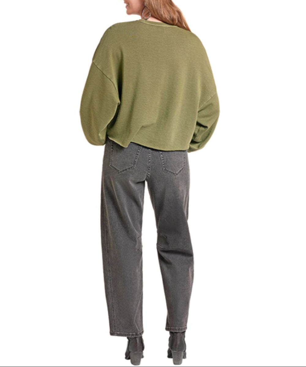 Back view of the women's oversized olive green crew neck sweatshirt featuring the dropped shoulders, mineral wash, and cropped raw hem