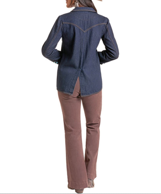 Back view of the women's dark washed denim western-style shirt jacket with contrast stitching, single point back yoke, and a back slit