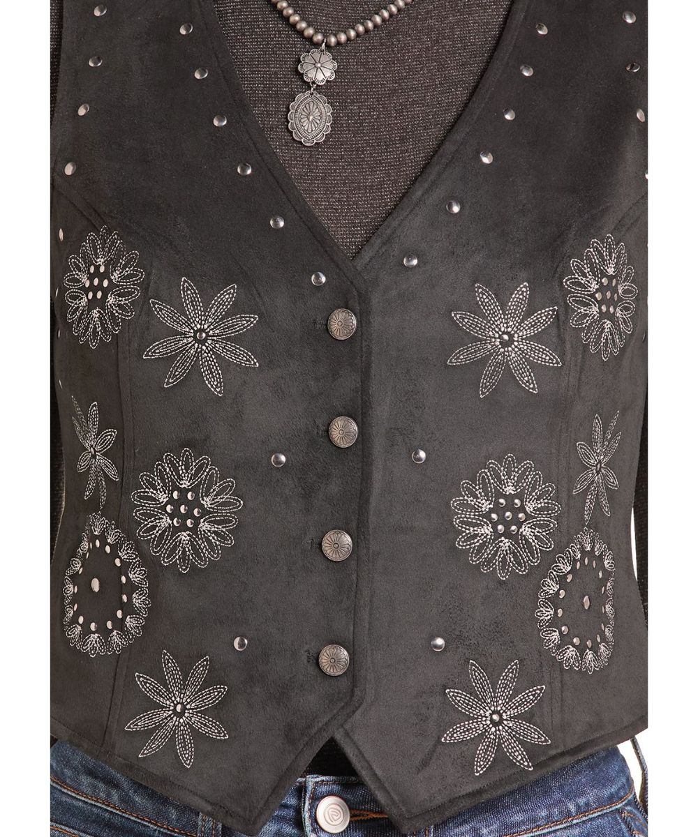 Close-up view of the floral embroidered design and silver studs on the front of the women's black vest