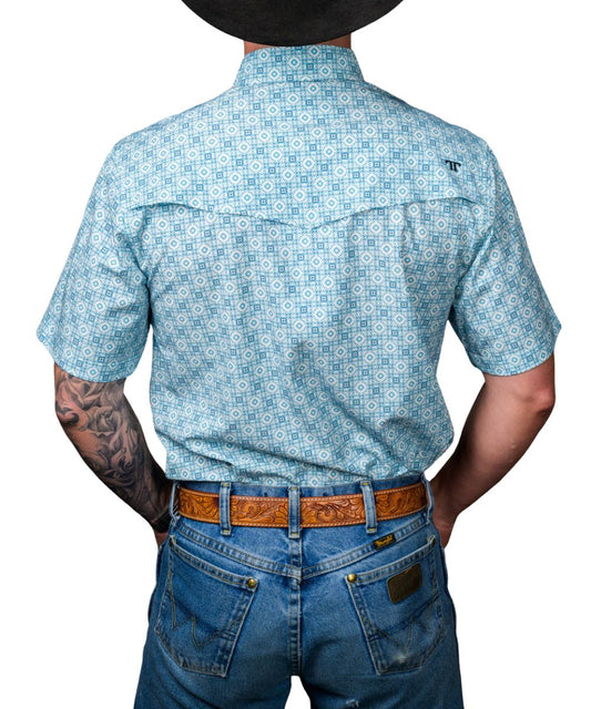 Back view of the men's blue geometric print pearl snap shirt featuring a vented back yoke