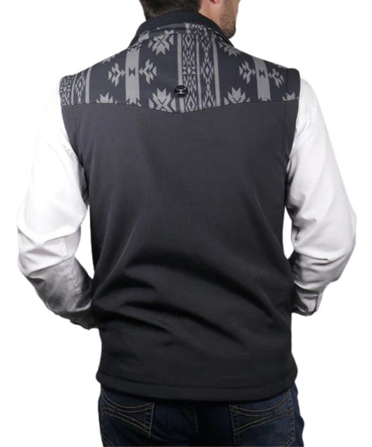 Back view of the men's black softshell vest featuring the aztec printed yokes and all weather protection with wind protection and water resistance