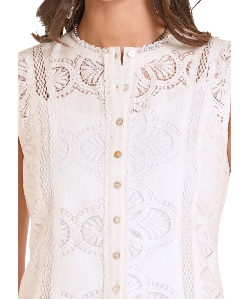 Close-up view of the lace front detailing and shell buttons