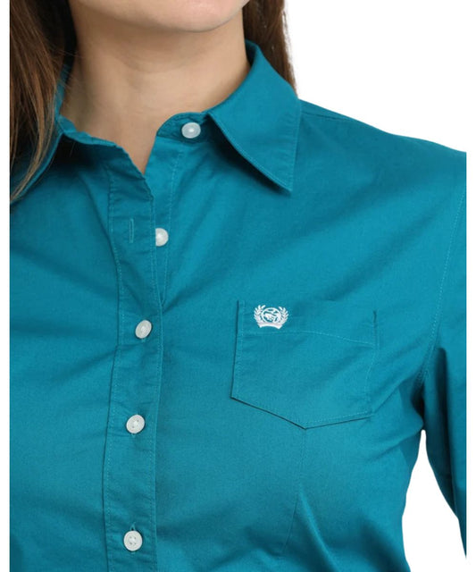 Close-up view of the solid teal print featuring the darting for a flattering fit