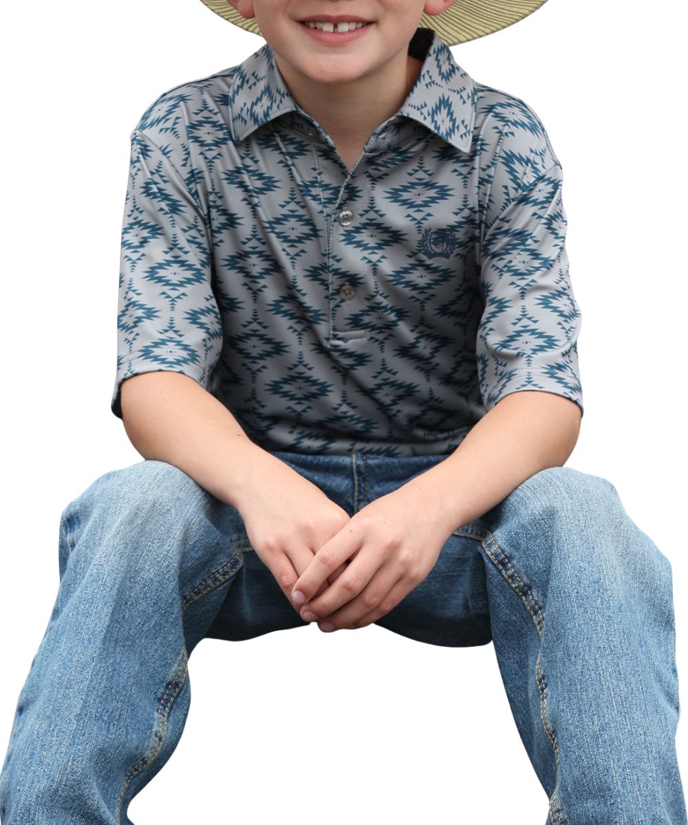 Front view of the boy's gray short sleeve polo shirt featuring a teal southwestern aztec print