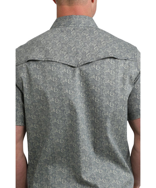 Back view of the men's navy snap shirt featuring a vented back yoke