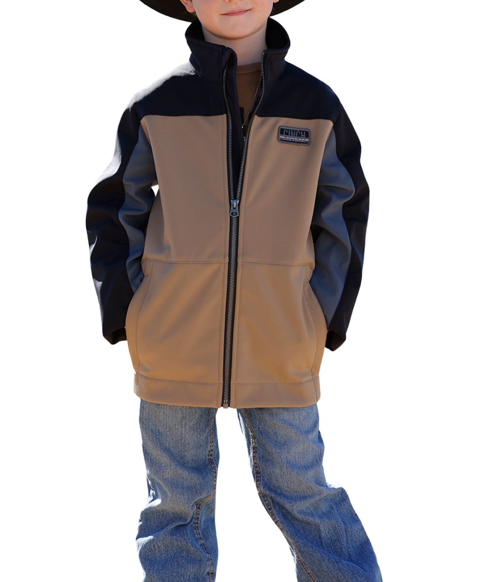 Front view of the boy's color blocked Cinch Bonded Jacket featuring the tan body and black & gray sleeves, zip closure, snap cuffs, and the durable water-resistant finish