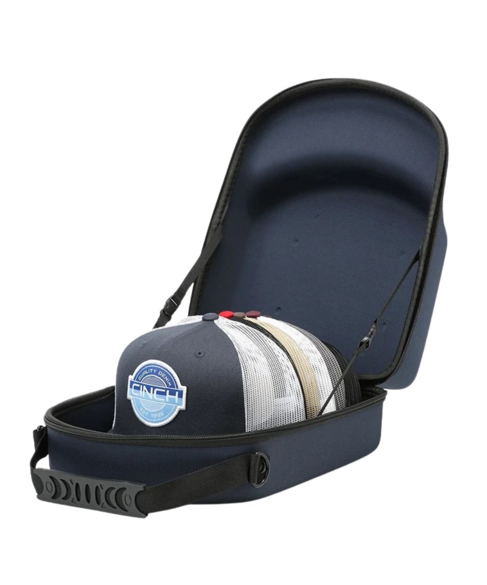 A navy blue hard-shell carrying case with an open lid, shown on a white background. A baseball cap with a blue and white 'ONCH' logo is placed inside the case.