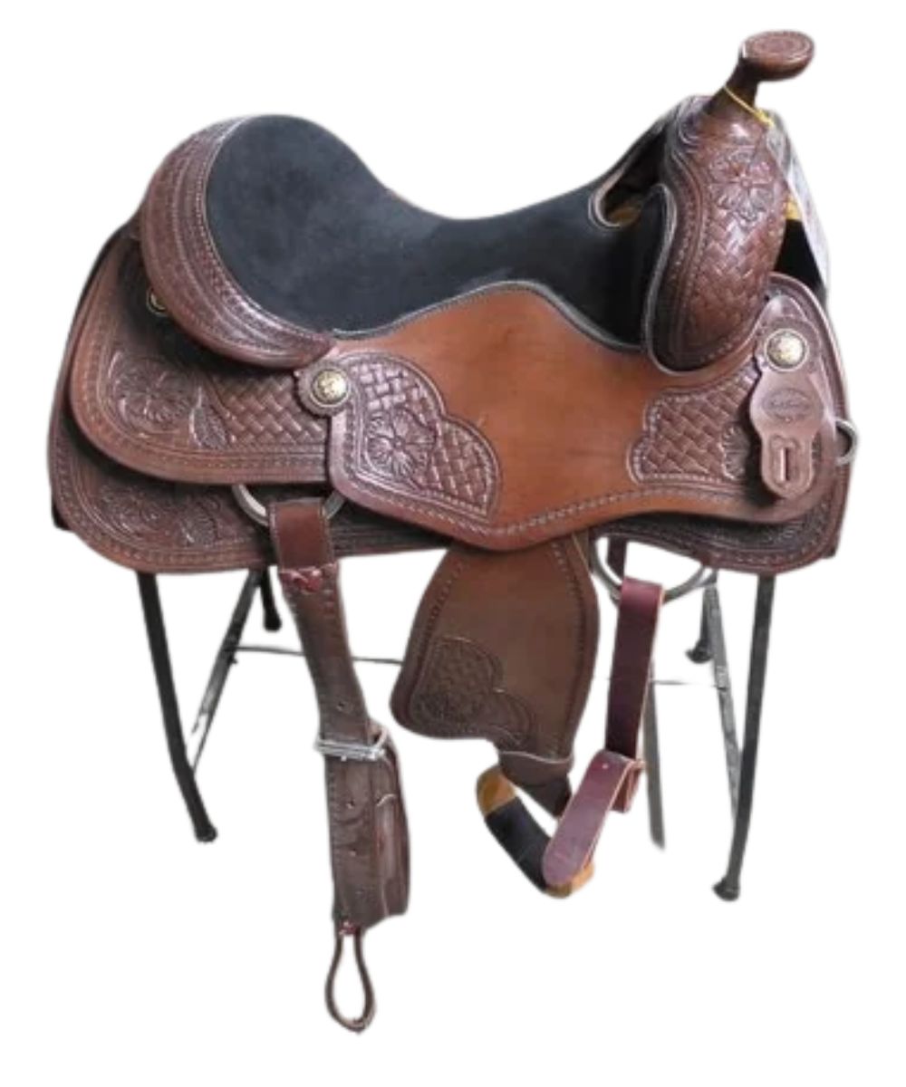 A brown leather western saddle with intricate tooling and floral patterns, displayed on a black metal stand against a white background.