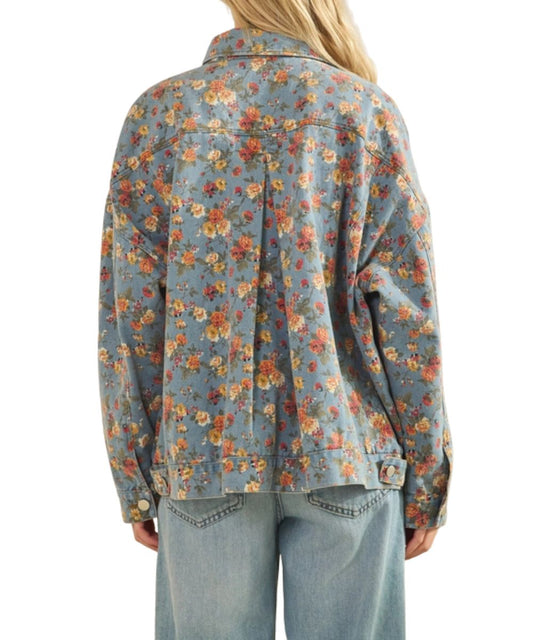 Blue denim jacket featuring a boho floral rose print and an inverted pleat on the back.