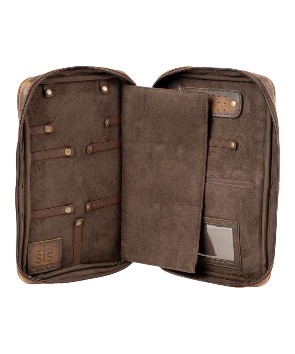 Interior view of the women's cowhide jewelry case featuring the 10 interior elastic bands with snaps and the padded interior divider