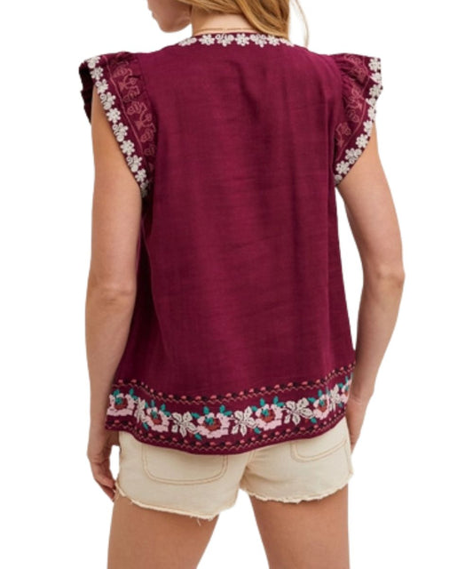 Back view of the women's plum boho top featuring intricate floral embroidery