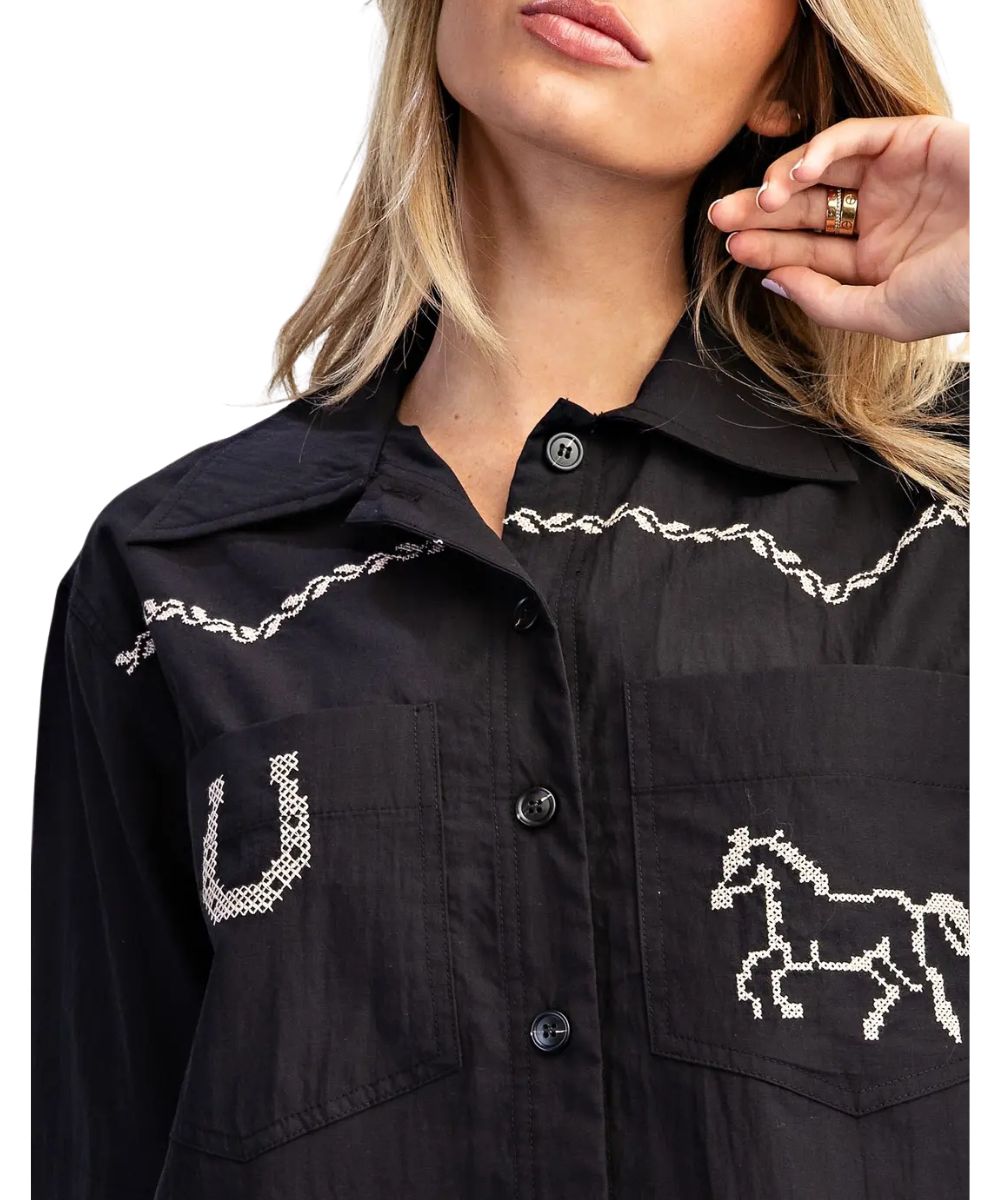 Close-up view of the western-themed decorative white stitching and spread collar on the front