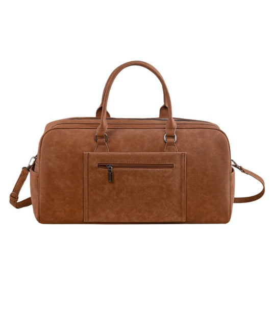 Back view of the women's brown faux leather weekender bag featuring the zipper pocket on the back with a trolley sleeve, top carry handles, and removable/adjustable crossbody strap