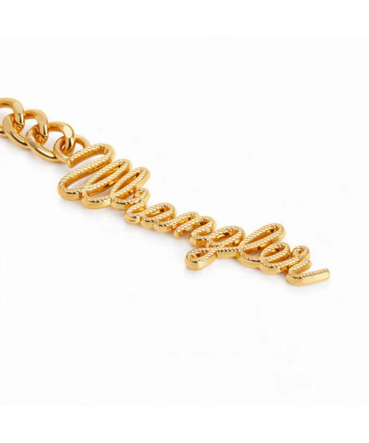 gold wrangler charm on white background