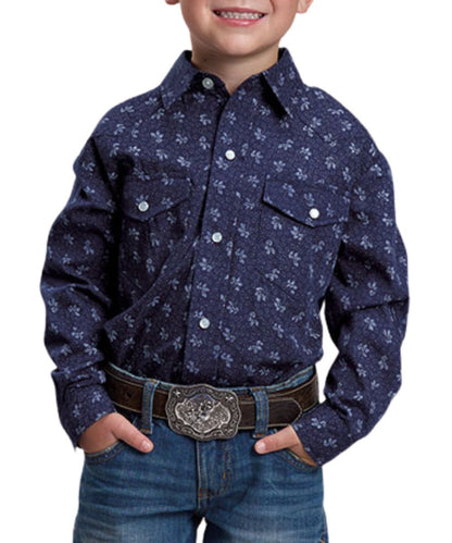 Front view of the boy's Roper navy blue long sleeve snap shirt featuring the chest pockets, light grey wallpaper floral striped print, and western yokes
