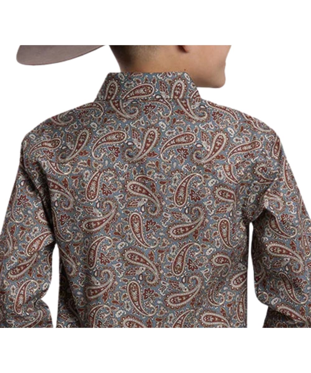 Back view of the boy's long sleeve western snap shirt featuring the single point back yoke and the paisley print