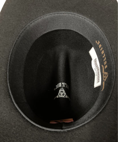 Close-up of the inside of a black felt hat, showing the crown lining, a white product tag, and gold embroidered text reading 'BULLHIDE' on the inner band.