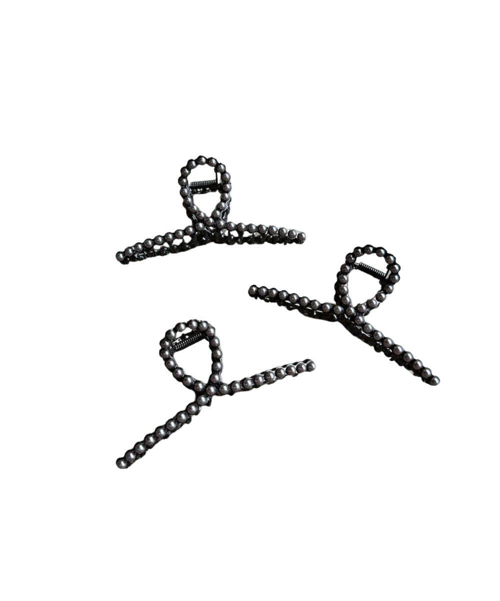 Women's metal claw clip featuring faux navajo pearl studs