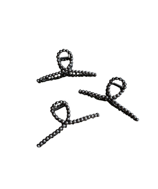 Women's metal claw clip featuring faux navajo pearl studs