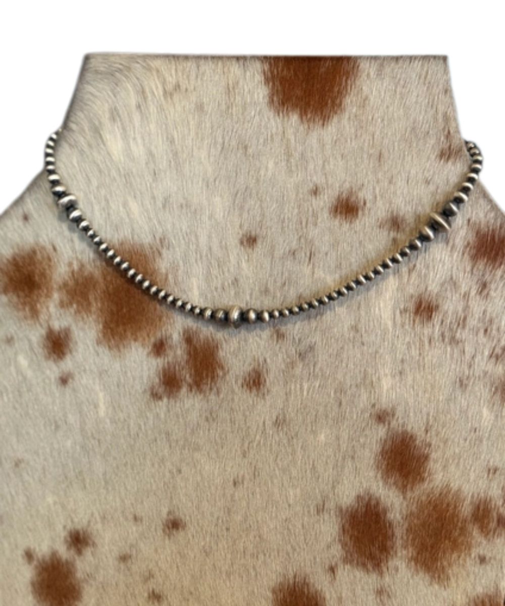 Z Bars Jewelry women's graduated sterling saucer navajo pearl necklace modeled on cowhide 
