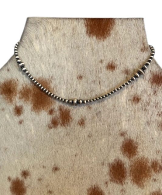 Z Bars Jewelry women's graduated sterling saucer navajo pearl necklace modeled on cowhide 