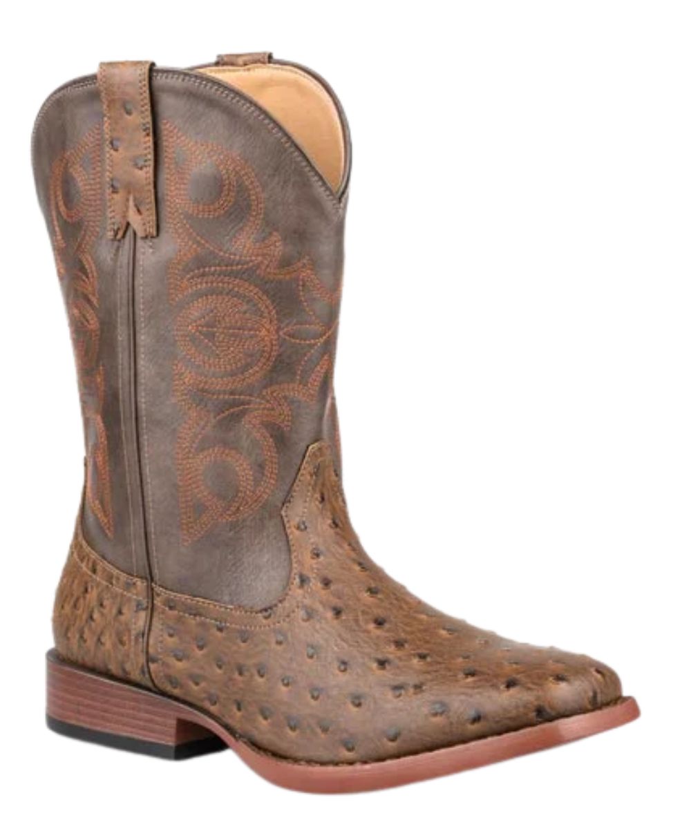 Right angled view of the little kid's brown Roper faux leather western boot featuring the 9" brown faux leather shaft with western stitch design, faux ostrich brown vamp, overlay brown mule ear pull tabs, brown piping, wide square toe, flexible bottom, and a stockman heel