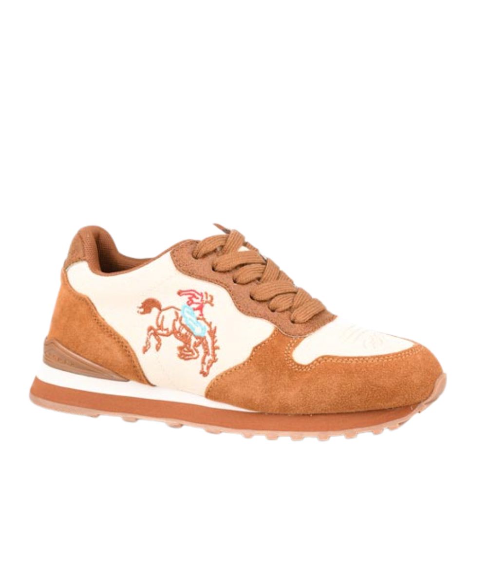 A low-top sneaker featuring tan suede and off-white leather panels, with a brown embroidered cowboy on a horse graphic on the side. The shoe has a brown laces and a brown midsole, set against a plain white background.