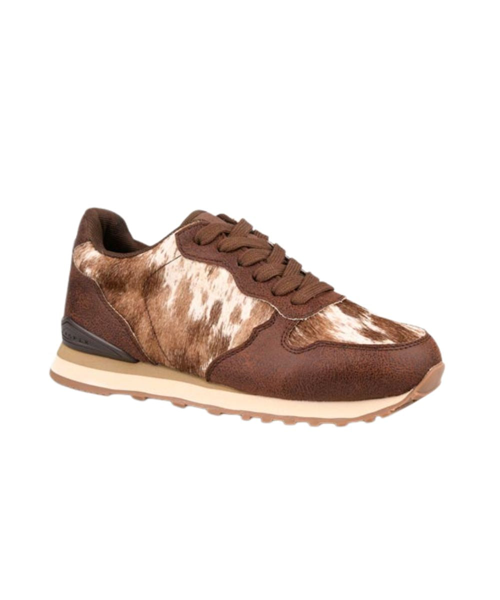 A low-top sneaker featuring brown suede panels and a brown-and-white cowhide pattern on the toe box and side panels, with a beige midsole and brown laces, shown against a plain white background.
