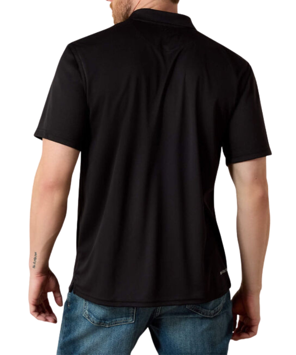 A man viewed from the back wearing a black short-sleeve polo shirt and blue jeans against a plain white background.