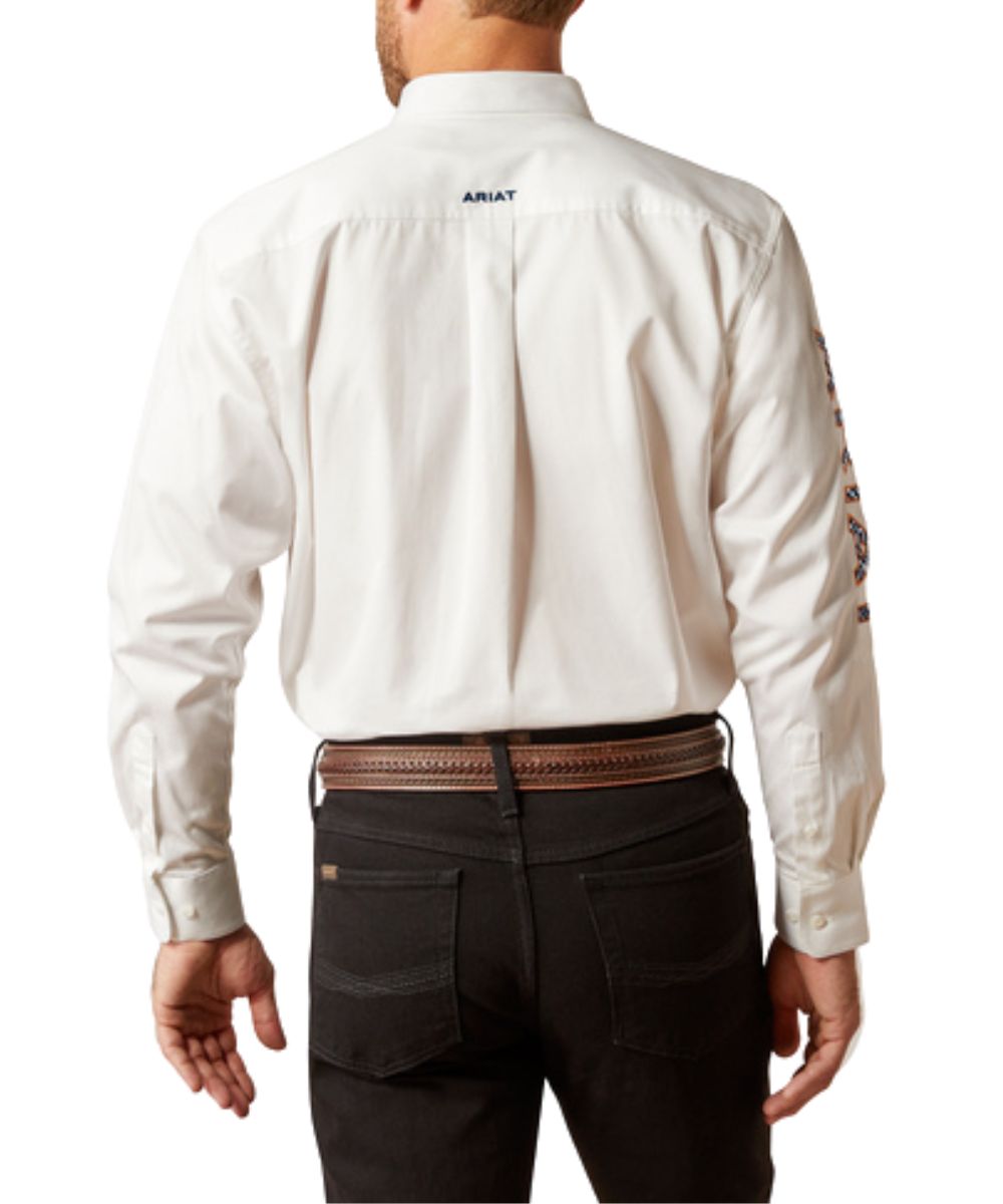 Back View Of The Men's White Button Down Featuring Black Logo Embroidery And A Straight Back Yoke With Box Pleat