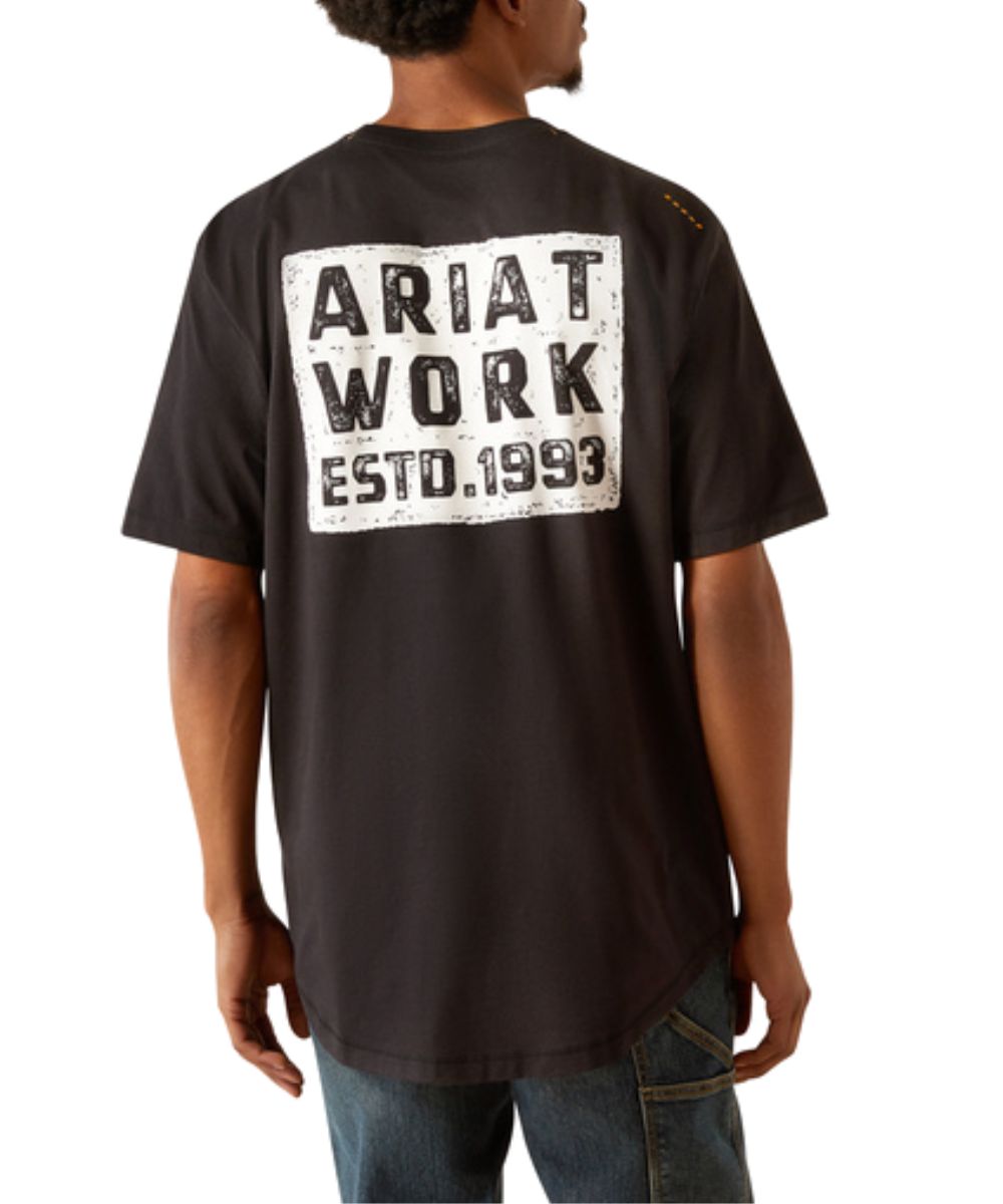 Back view of the men's black Ariat Rebar Workman Brickyard Tee featuring the screen print that reads: "Ariat Work ESTD. 1993" and the long back hem for extra coverage