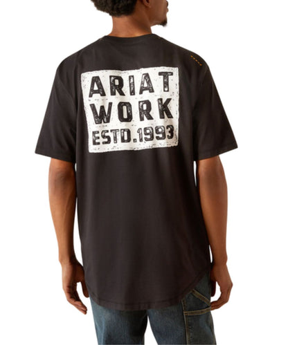 Back view of the men's black Ariat Rebar Workman Brickyard Tee featuring the screen print that reads: "Ariat Work ESTD. 1993" and the long back hem for extra coverage